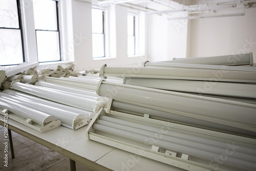 Reusable office lighting fixtures removed during renovation