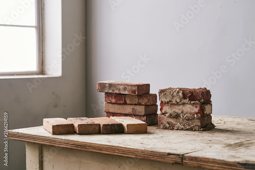 Reclaimed clay bricks prepared for reuse in salvage workspace