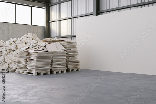 Gypsum board recycling materials stored in recovery facility