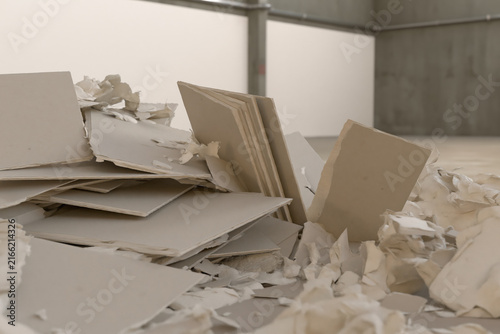Broken gypsum board collected for construction material recycling