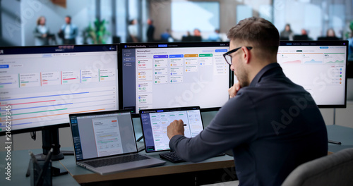 Business Analyst Uses Laptop