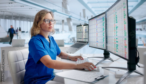 Woman Reviews Medical Billing Codes On Laptop