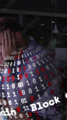 Working late in office, man surrounded by blockchain and binary code animation