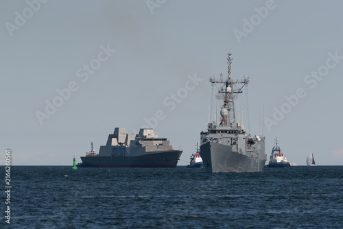 POLISH NAVY-The new Polish frigate ORP Wicher, after being launched, returns to the shipyard accompanied by tugboats and symbolically led to the port by the Olivier Hazard Perry-class missile frigate