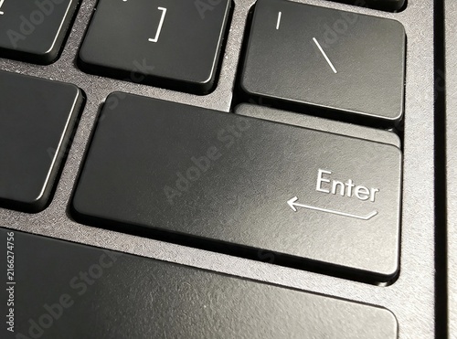 Obraz na płótnie Macro Close Up of Enter Return Key on Modern Black Laptop Keyboard