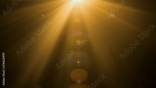 Golden sunlight bloom with atmospheric haze, isolated black