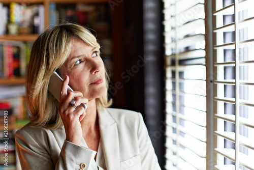 Obraz na płótnie Phone call, lawyer or woman at office by window for court case update, legal leverage or trial date