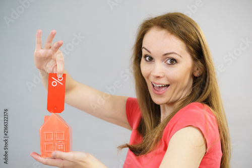 Woman buying house in low price.