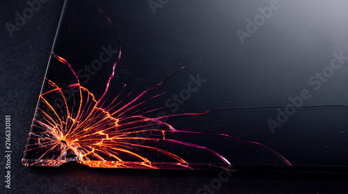 Cracked Glass with Glowing Lava Light Veins, Dark Macro Texture Background with Copy Space for Text