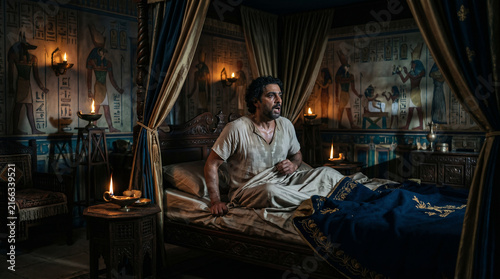 Pharaoh waking up in a cold sweat from his terrifying nightmare of seven gaunt cows devouring seven fat cows