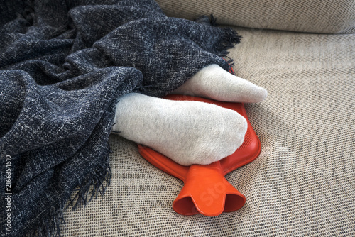 Bild auf Leinwand Hot water bottle, a warm foot warmer for a cold day.