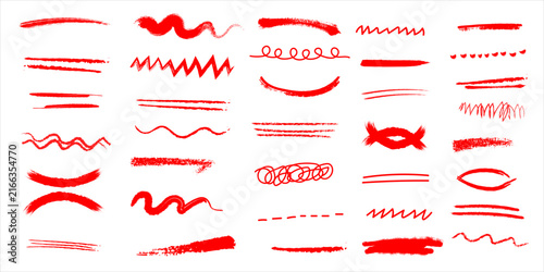 Collection of various red paint brush strokes and hand drawn design elements on white background