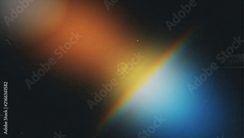 Abstract light leak overlay with orange yellow rainbow prism flare for cinematic vintage edit.