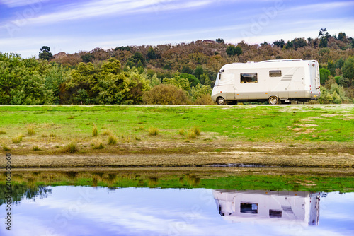 Camper rv camping at lake shore. Alentejo Portugal.