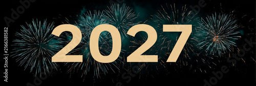 Golden '2027' number floats amid dazzling fireworks against dark sky. Perfect for new year, anniversary, or futuristic event designs. Celebratory and elegant visual with glowing sparkles
