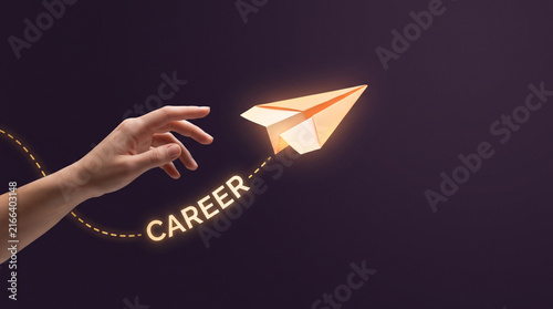 Hand launching a paper airplane with career text path representing business growth