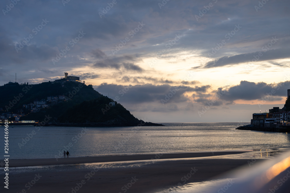 Fototapeta premium Golden Sunset over La Concha Bay and Beach in San Sebastian, Basque Country, Spain