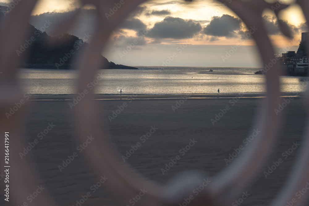 Fototapeta premium Golden Sunset over La Concha Bay and Beach in San Sebastian, Basque Country, Spain