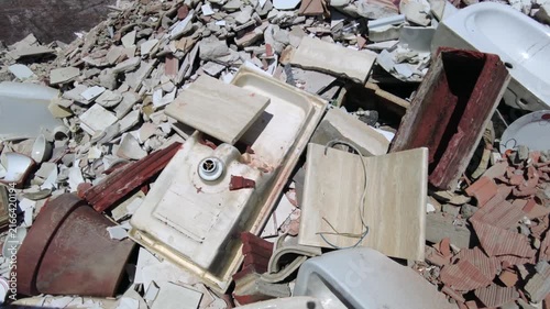 Europe, Italy, Milan: municipal sorted waste collection in Recycling and Waste Drop-off Center—RAE and household waste (glass, plastic, appliances, iron, paper, wood) separated for recycling at an Ams
