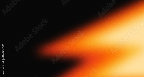 Grainy vintage light leak abstract background with orange and yellow glows