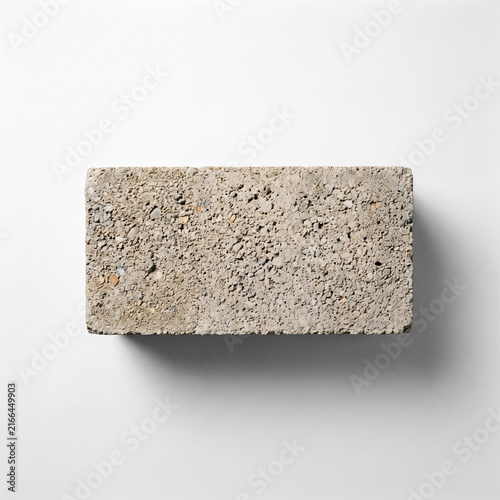 Single gray concrete cinder block isolated on white background