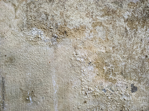 Weathered concrete wall with peeling paint industrial architecture