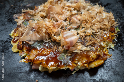 Okonomiyaki Topped With Bonito Flakes And Savory Sauce