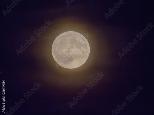 Halo around the moon in the night sky