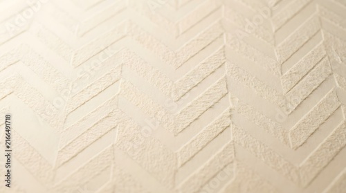 Soft pastel gradient background with subtle quilted texture in neutral tones