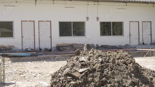 view to dirt at a construction site among sunny day, loading dirt on ground at construction site while prepare area for builing the house
