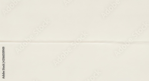 Minimalist beige fabric texture with horizontal seam line creating simple elegant pattern for clean interior wall design project.