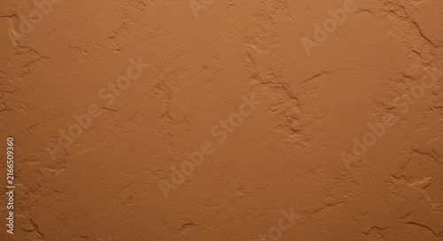 Rustic textured brown cement or concrete wall background with natural rough finish and uneven surface.