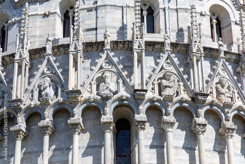 detail of carving and statuary on the baptistery at pisa tuscany italy sunny day