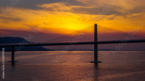 Peljesac Bridge over Adriatic Sea at sunset