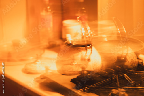 Foto Abstract intentional camera movement with double exposure effect of teapot on ki