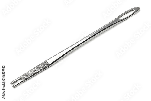 Konstfotografi Polished Bodkin Threading Tool With Elongated Metal Body And Detailed Grip On Wh
