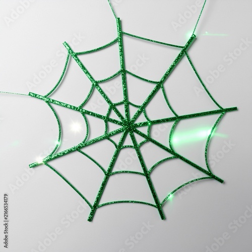 Green glittering spider web for holiday decoration indoor view