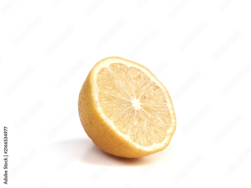 Naklejka premium Fresh half sliced yellow lemon fruit showing juicy pulp isolated on a solid white background. Ideal for food, beverage, health, citrus, culinary, and organic product design projects