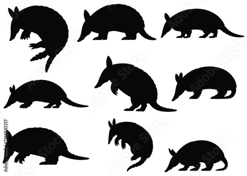 Nine armadillo silhouettes against a white background