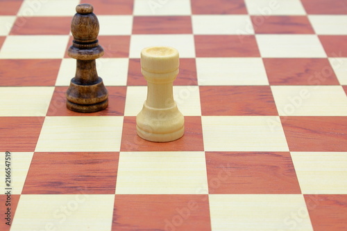 Canvastavla Wooden chess board. Black bishop and white rook.