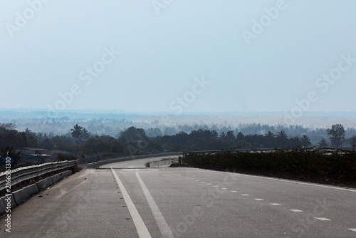 Highway landscape with morning fog