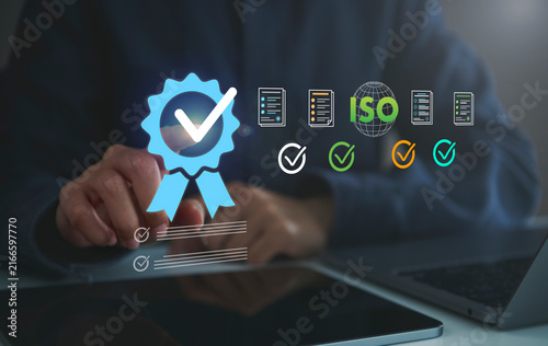 Obraz na plátně ISO quality certification with person using laptop and digital checklist to verify standards support compliance improve quality control strengthen trust and ensure reliable business processes