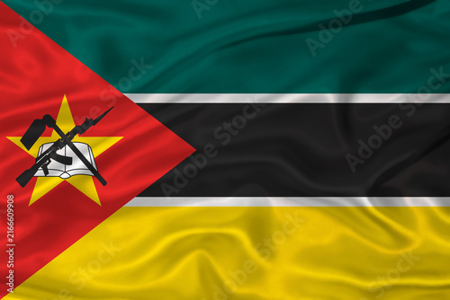 Flag of Mozambique with a soft fabric texture. Mozambican flag textured with fabric background