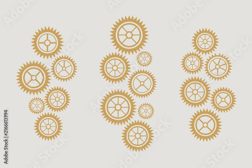 A collection of golden gear arranged in three vertical clusters on a light grey background for use