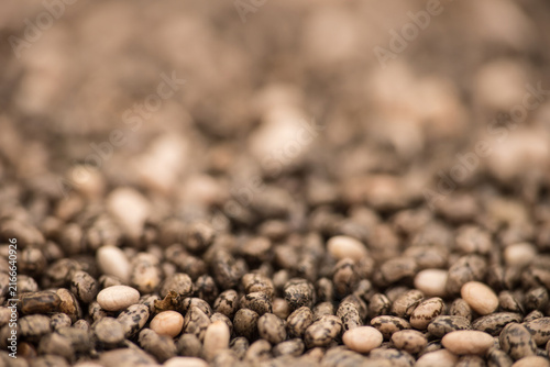 Raw organic chia seeds macro close up texture with shallow depth of field