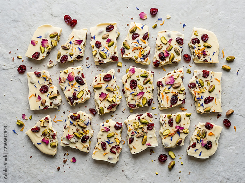 Delicious artisanal white chocolate bark pieces arranged neatly on a rustic surface offering a delightful sensory experience for confectionery lovers and gourmet dessert enthusiasts everywhere