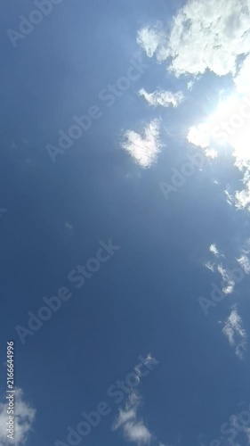 A timelapse of the movement of clouds against the blue sky on a warm summer day. View of the sky and slowly floating fluffy clouds.
