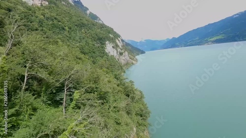 FPV Drone Flight Along a Mountain Above a Swiss Alpine Lake