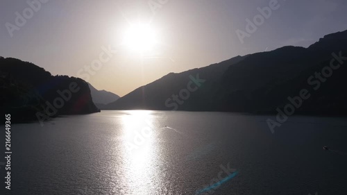 Aerial View of Sailing boat on a Swiss Alpine Lake sunset