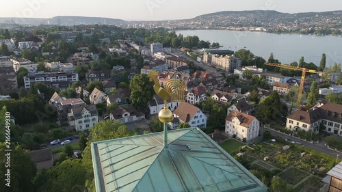 Drone Circling a Church Steeple Above the Zurich Cityscape